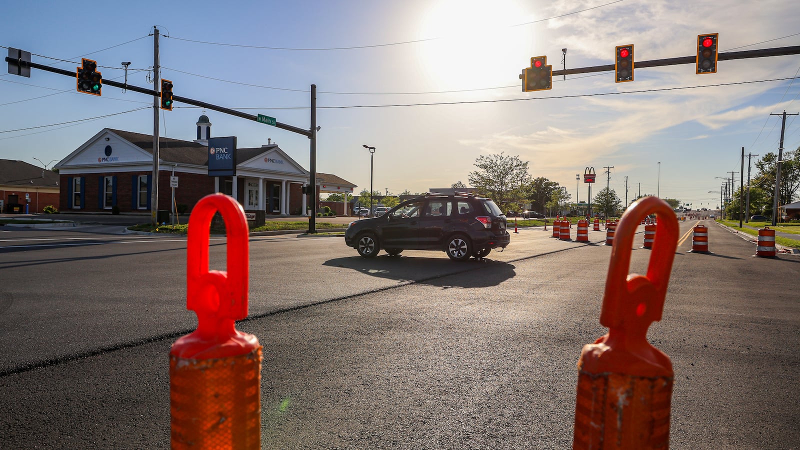 A person drives a vehicle through the intersection of West Main Street and Dorset Road in Troy. A years-long project on Troy's busiest street is nearly complete, but another major project will soon be underway when a roundabout is installed at the intersection of Adams Street, Riverside Drive and Staunton Road. BRYANT BILLING / STAFF